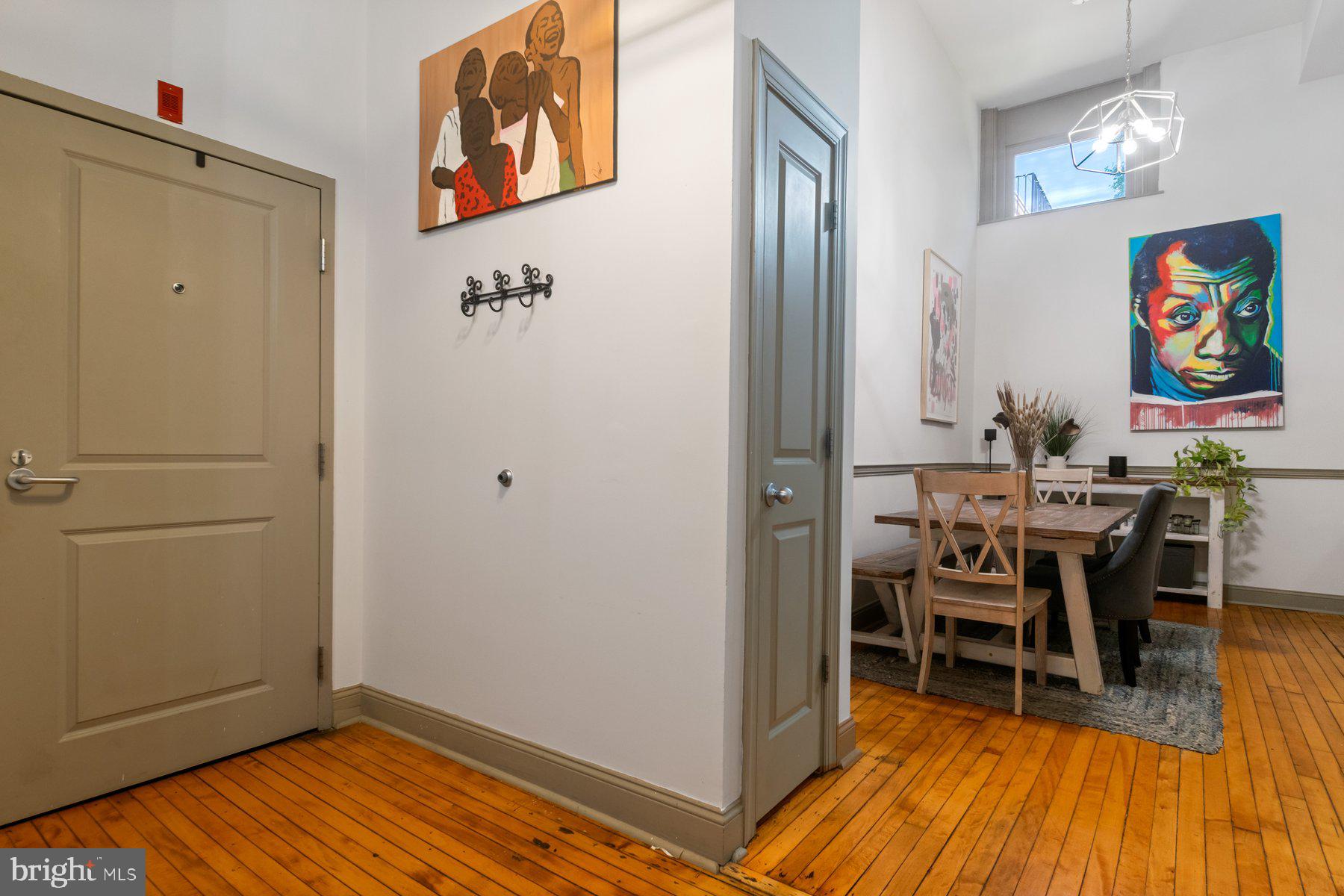 511 South Bond Street, Unit 206 Baltimore, MD 21231 - Photo 13 of 27 a view of a dining room with furniture and wooden floor
