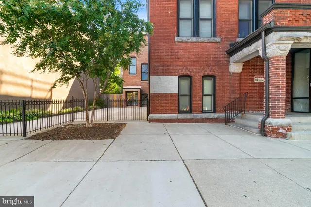 a view of a building with potted plants