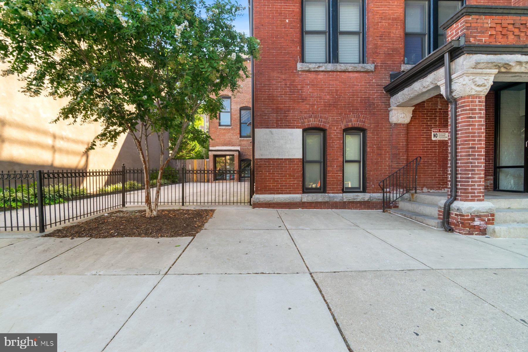 511 South Bond Street, Unit 206 Baltimore, MD 21231 - Photo 23 of 27 a view of a building with a tree