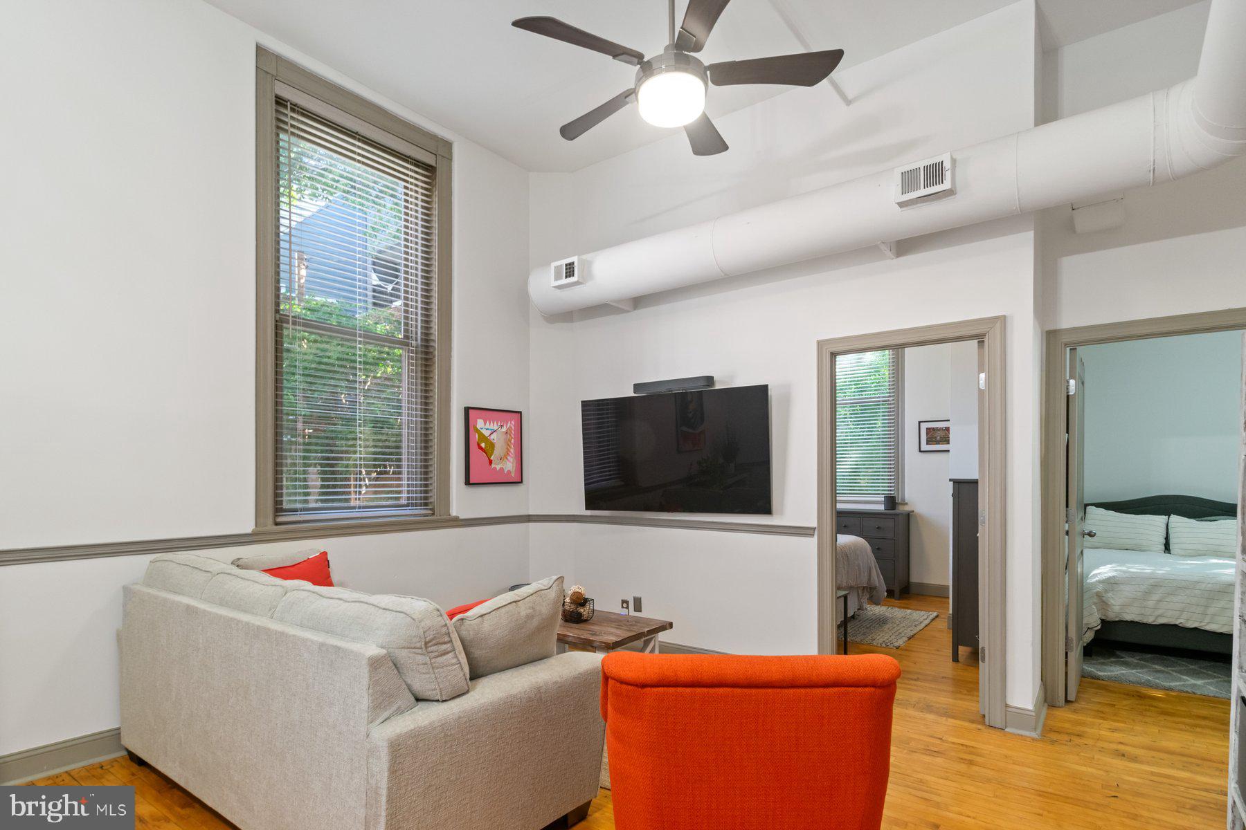 511 South Bond Street, Unit 206 Baltimore, MD 21231 - Photo 3 of 27 a living room with furniture and a flat screen tv