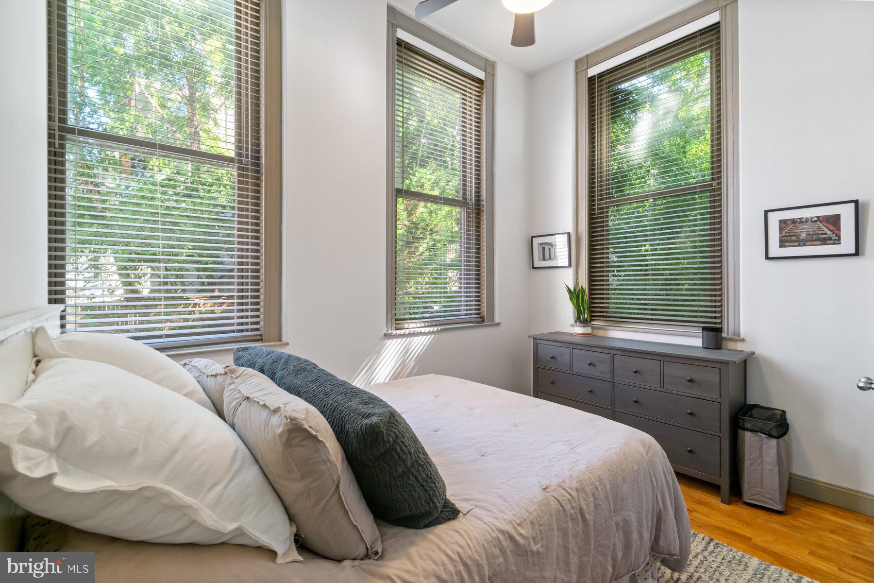 511 South Bond Street, Unit 206 Baltimore, MD 21231 - Photo 5 of 27 a bedroom with a bed and a window