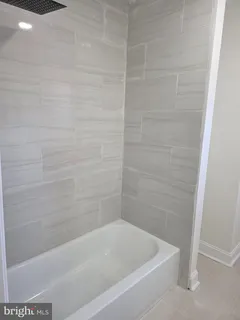 a bathroom with a bathtub