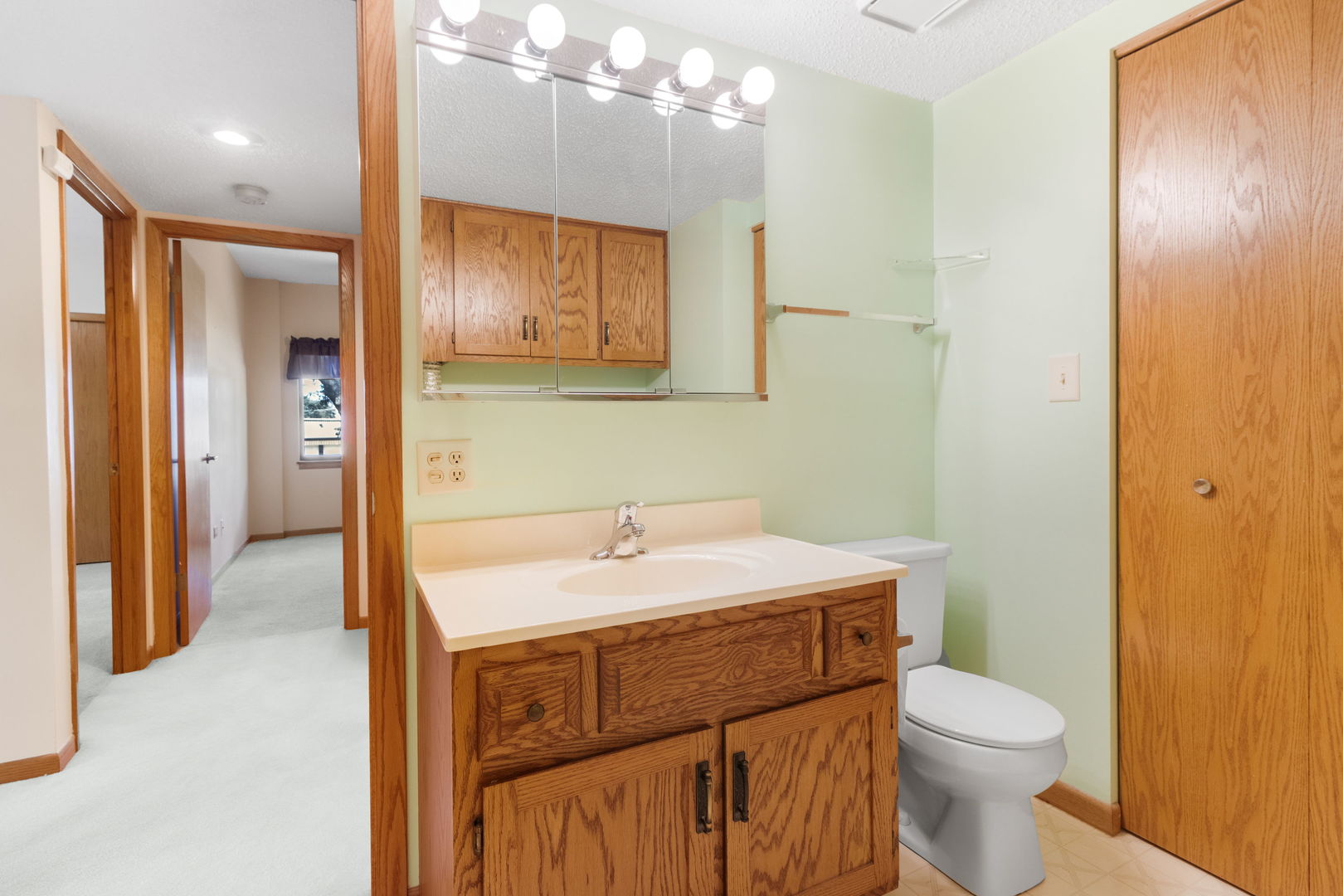 3119 Ingalls Avenue, Unit 2A Joliet, IL 60435 - Photo 11 of 20 a bathroom with a sink a toilet and shower
