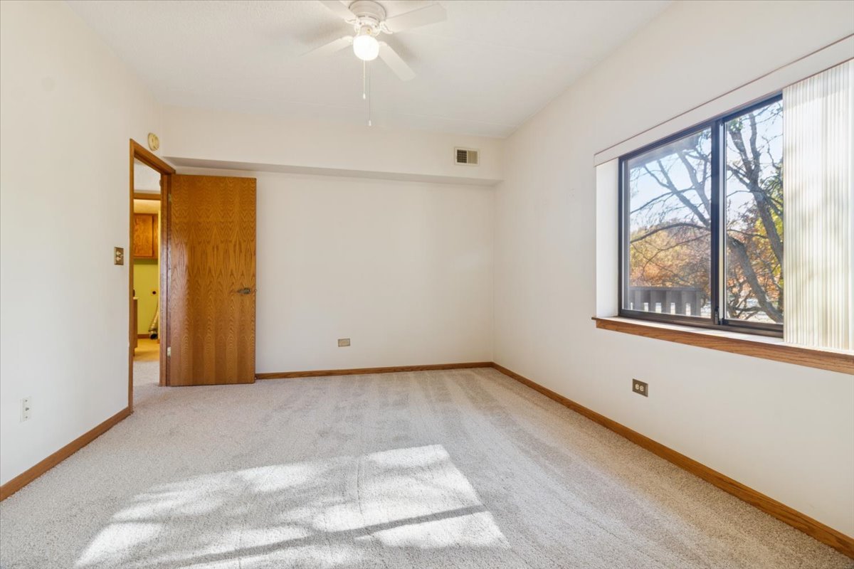 3119 Ingalls Avenue, Unit 2A Joliet, IL 60435 - Photo 13 of 20 a view of an empty room with a window