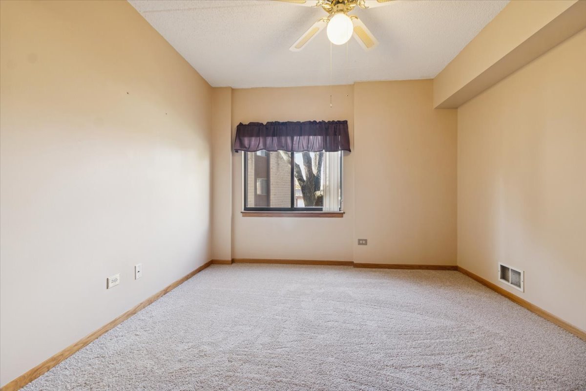 3119 Ingalls Avenue, Unit 2A Joliet, IL 60435 - Photo 16 of 20 an empty room with a window