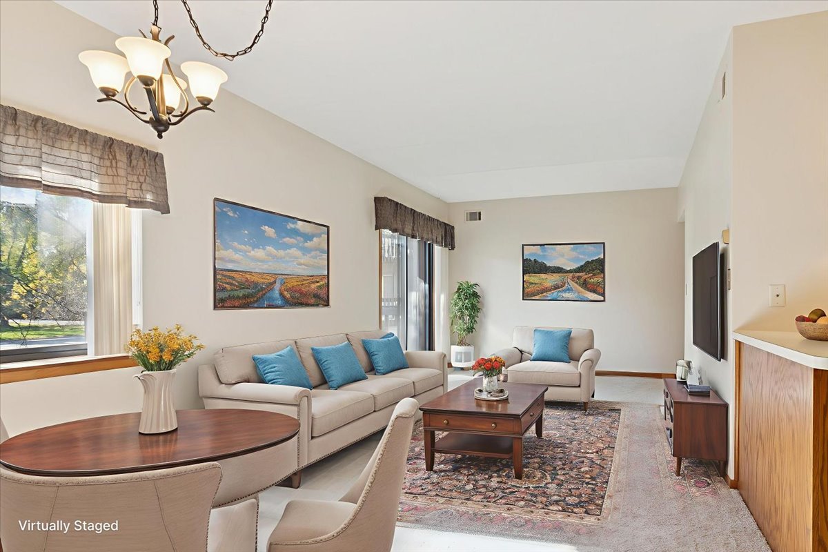 3119 Ingalls Avenue, Unit 2A Joliet, IL 60435 - Photo 2 of 20 a living room with furniture chandelier and a table