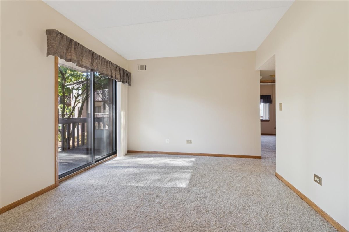 3119 Ingalls Avenue, Unit 2A Joliet, IL 60435 - Photo 9 of 20 a view of an empty room with a fireplace