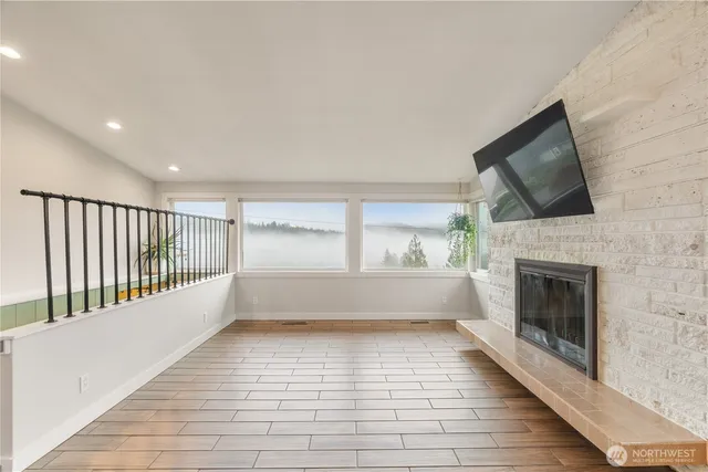 a view of a livingroom with furniture and a fireplace