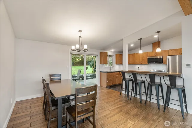 a kitchen with stainless steel appliances granite countertop a sink and a stove
