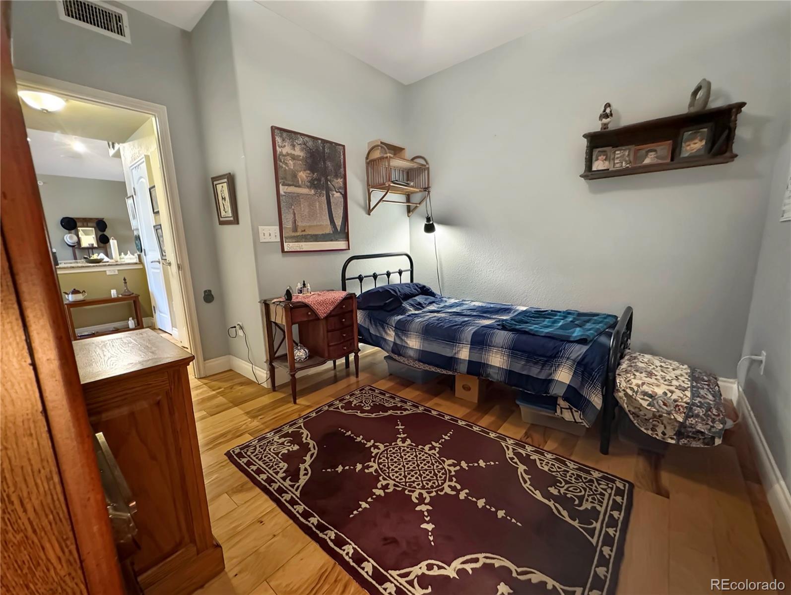 620 11th Street, Unit 306 Golden, CO 80401 - Photo 12 of 22 a living room with furniture and wooden floor