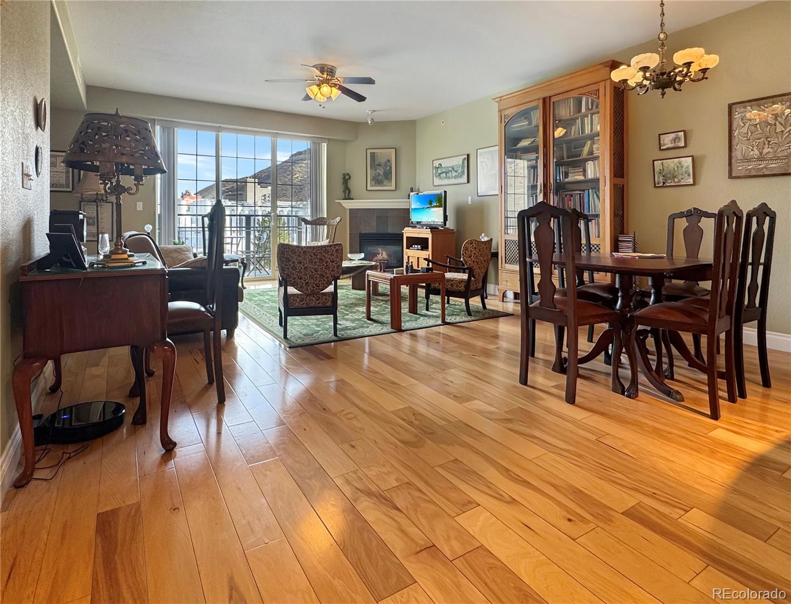 620 11th Street, Unit 306 Golden, CO 80401 - Photo 4 of 22 a view of a dining room with furniture window and wooden floor
