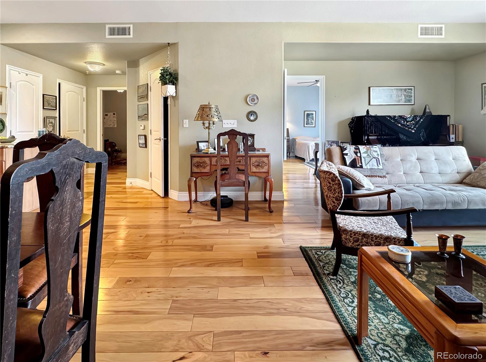 620 11th Street, Unit 306 Golden, CO 80401 - Photo 5 of 22 a living room with furniture and a wooden floor