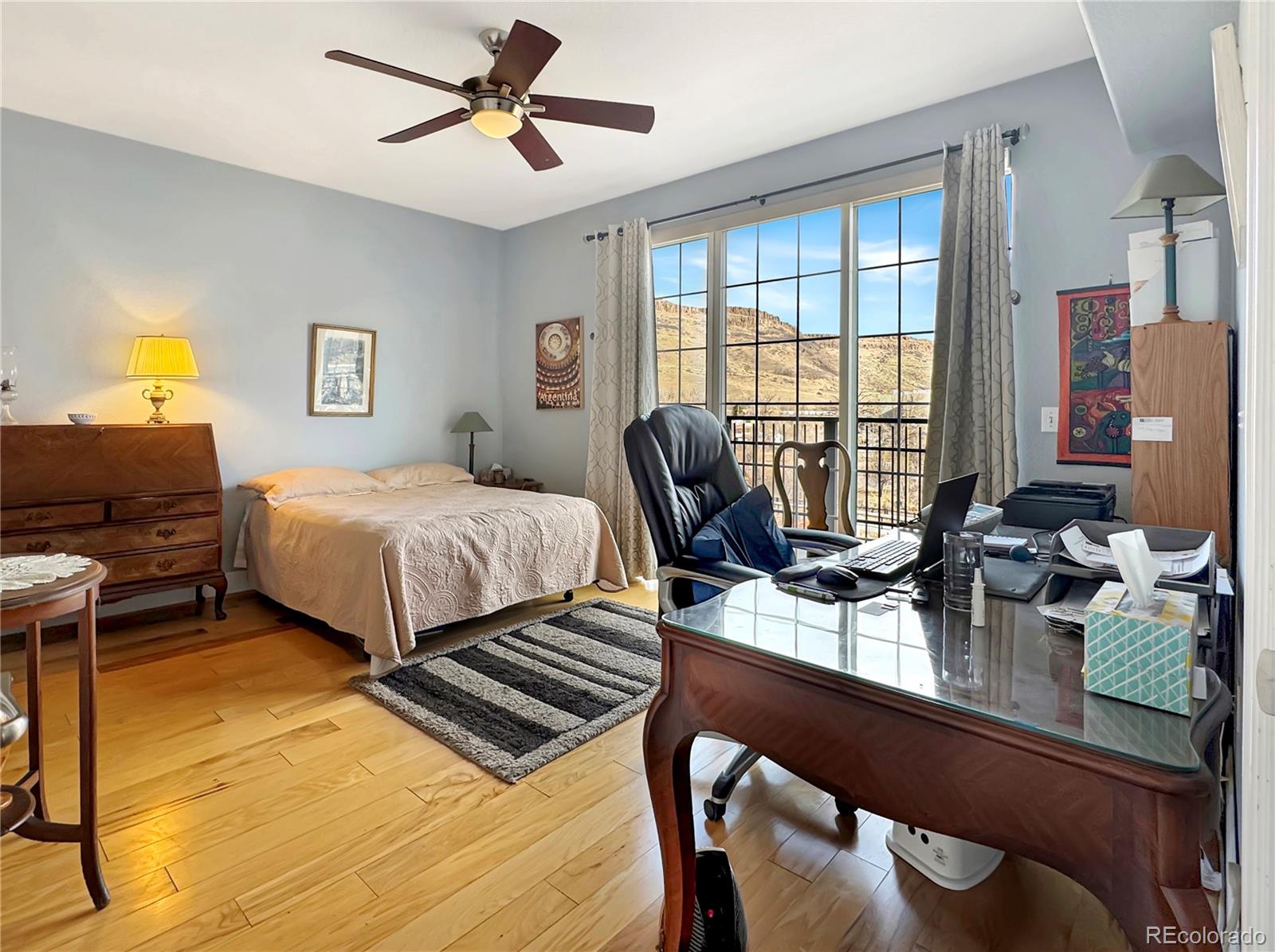 620 11th Street, Unit 306 Golden, CO 80401 - Photo 8 of 22 a bedroom with a bed and a desk