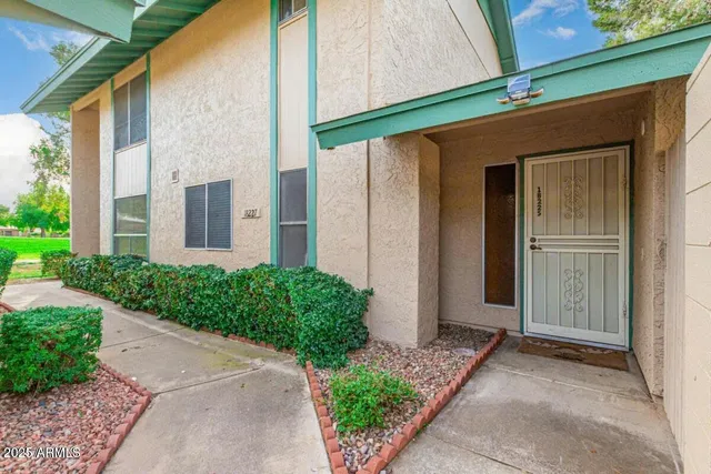 a front view of a house with garden