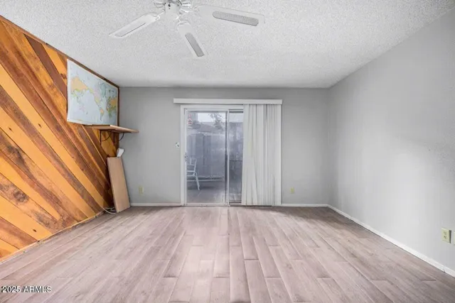 a view of hallway with stairs and wooden floor