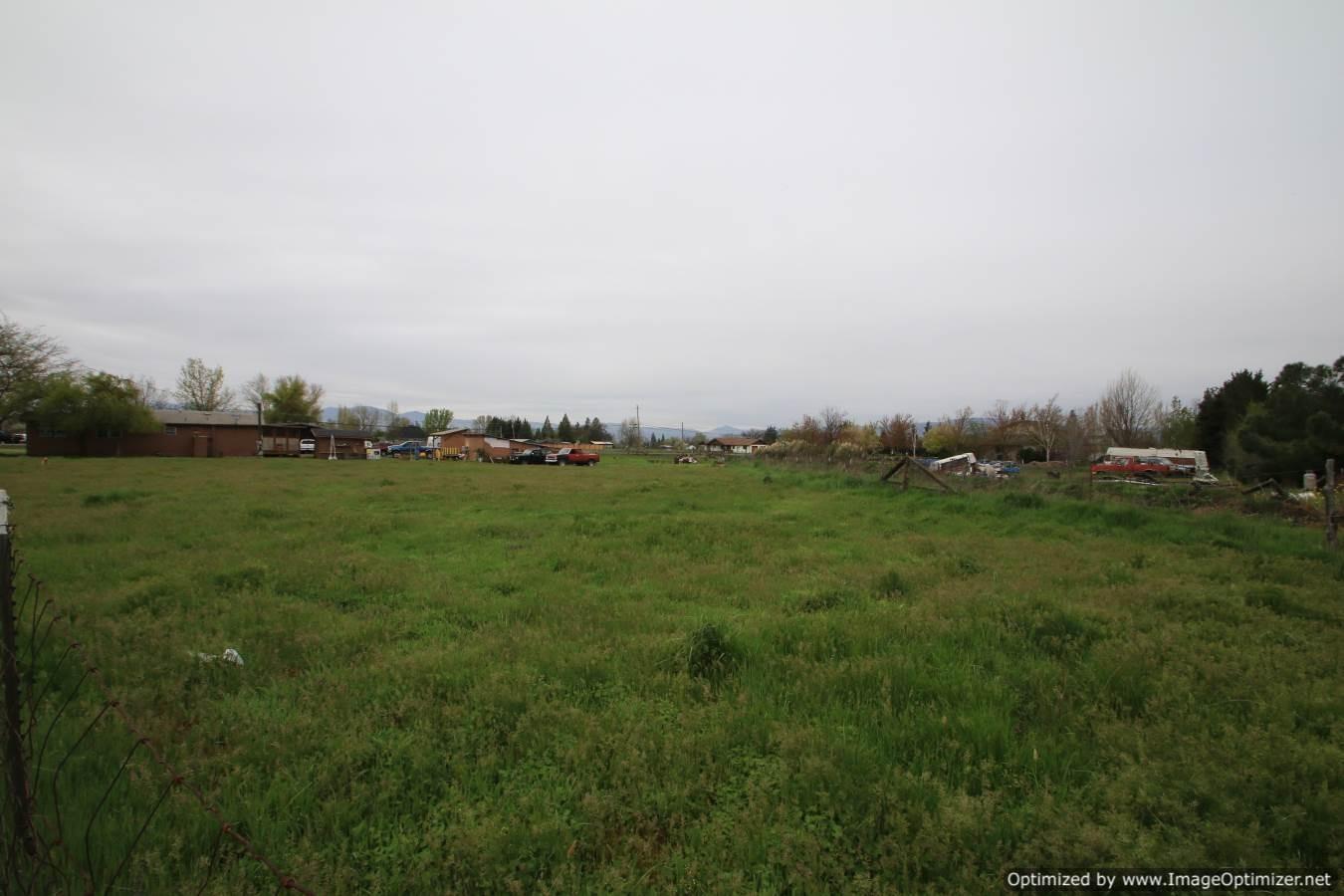 2531 East Gregory Road Central Point, OR 97502 - Photo 15 of 21 a view of grassy field with trees