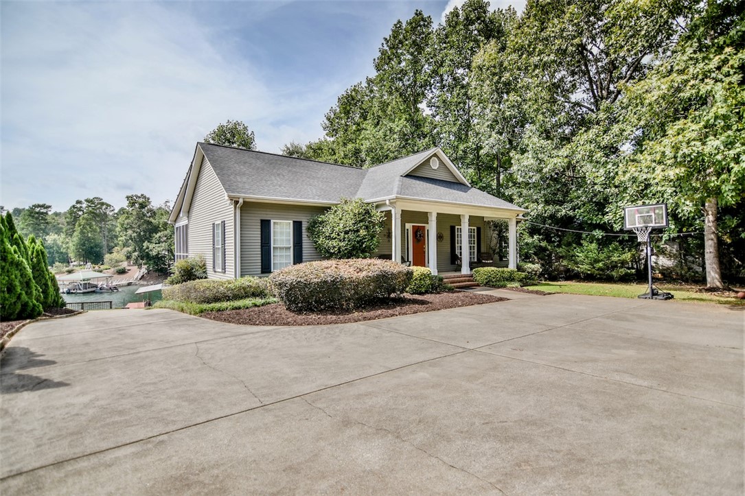 216 Petty Road Seneca, SC 29672 - Photo 1 of 40 Concrete Driveway Wraps Around Back of House