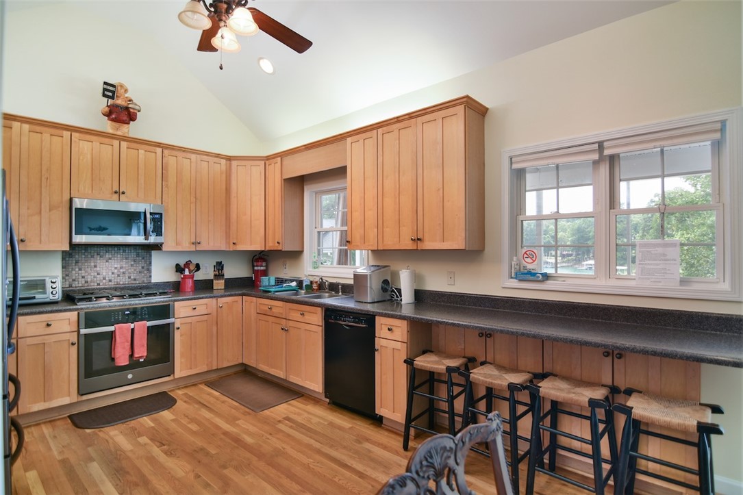 216 Petty Road Seneca, SC 29672 - Photo 17 of 40 Kitchen w/ Breakfast Bar Overlooking the Lake