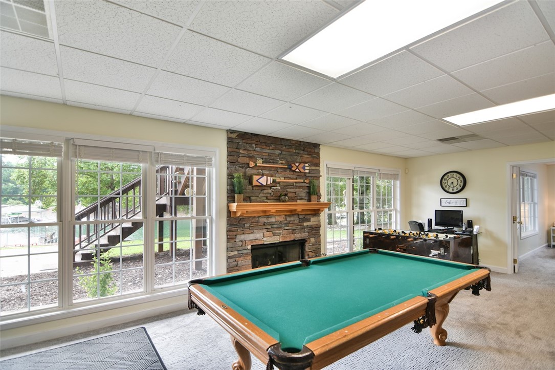 216 Petty Road Seneca, SC 29672 - Photo 27 of 40 Lower Level Game Room w/ Gas Log Stone Fireplace