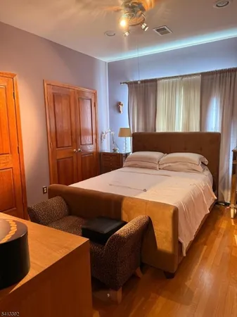 a bedroom with bed and window