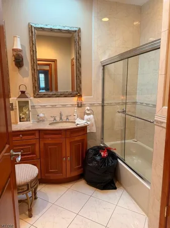 a bathroom with a sink a mirror and a bathtub