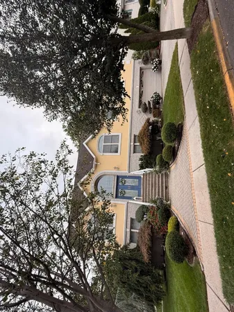 with view of a house with a yard