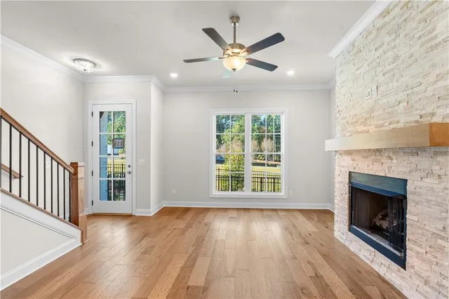 a large kitchen with kitchen island white cabinets and stainless steel appliances