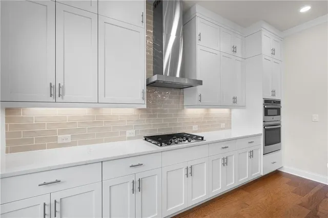 a kitchen with granite countertop a stove and a sink