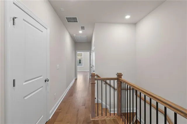 a spacious bathroom with a tub sink and mirror