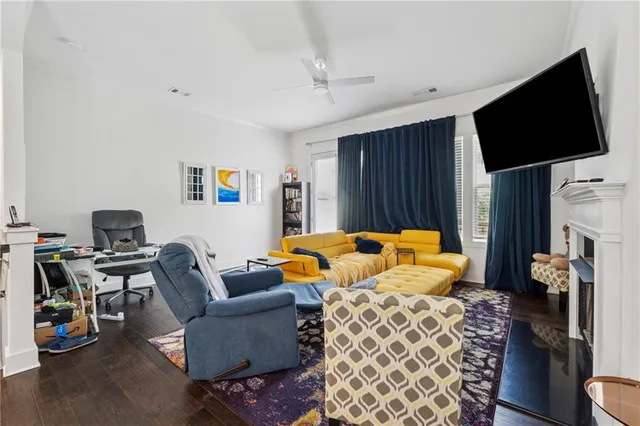 a bedroom with furniture and a flat screen tv
