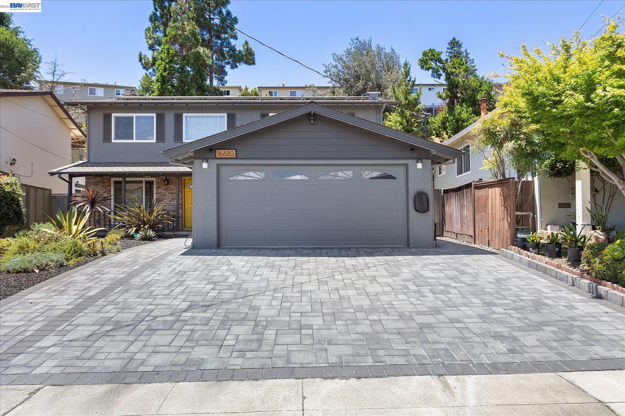 16683 Kildare Road Castro Valley, CA 94546 - Photo 2 of 77 a front view of a house with a yard and a garage