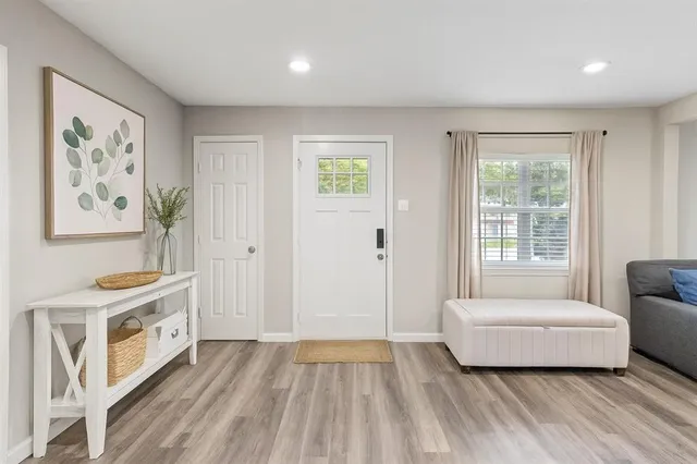 a spacious bedroom with a bed and a couch