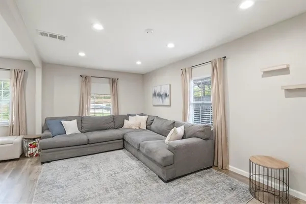 a living room with furniture and a window