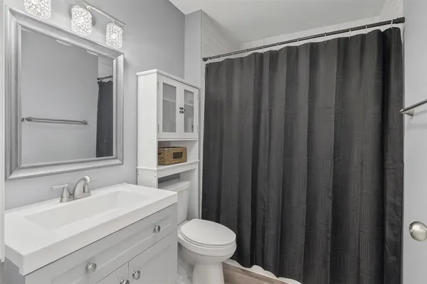 a bathroom with a sink and a toilet