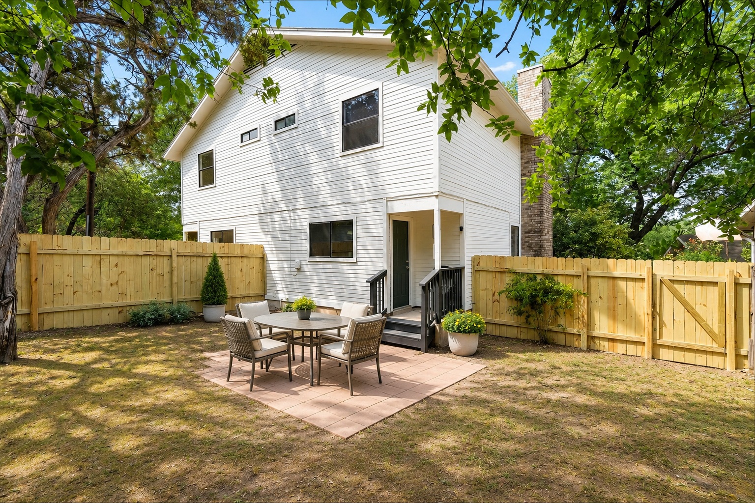 1707 Waterloo Trail, Unit A Austin, TX 78704 - Photo 2 of 4 A private, fenced backyard oasis with a patio, perfect for outdoor entertaining.
