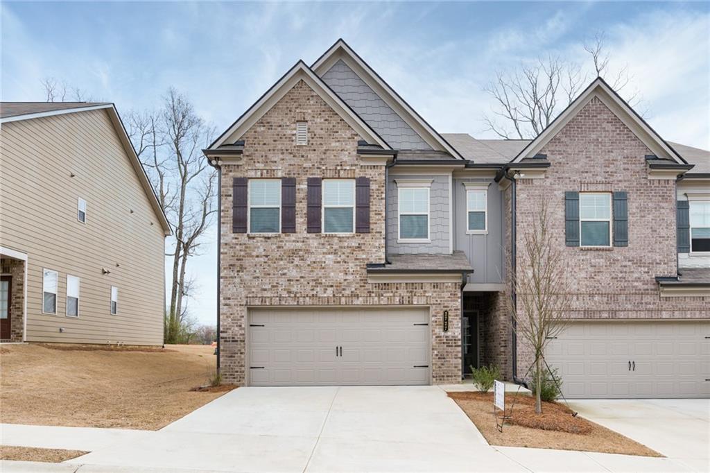 a front view of a house with a garage