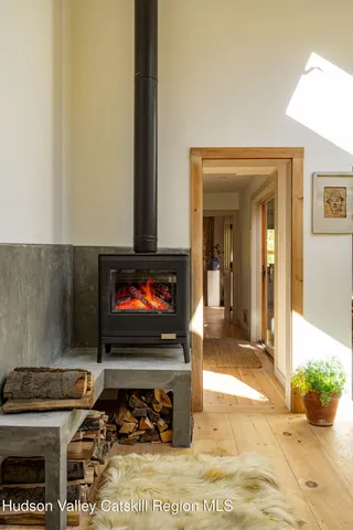 a living room with fireplace furniture and a flat screen tv