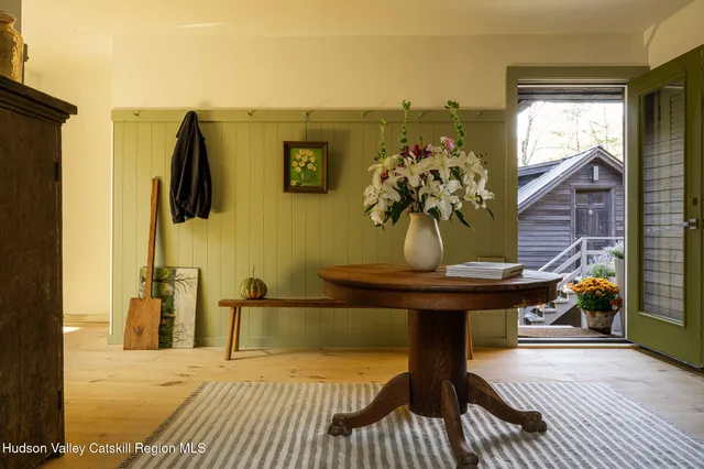 a workspace room with furniture and windows