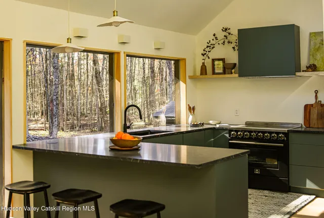 a kitchen with a stove and a sink