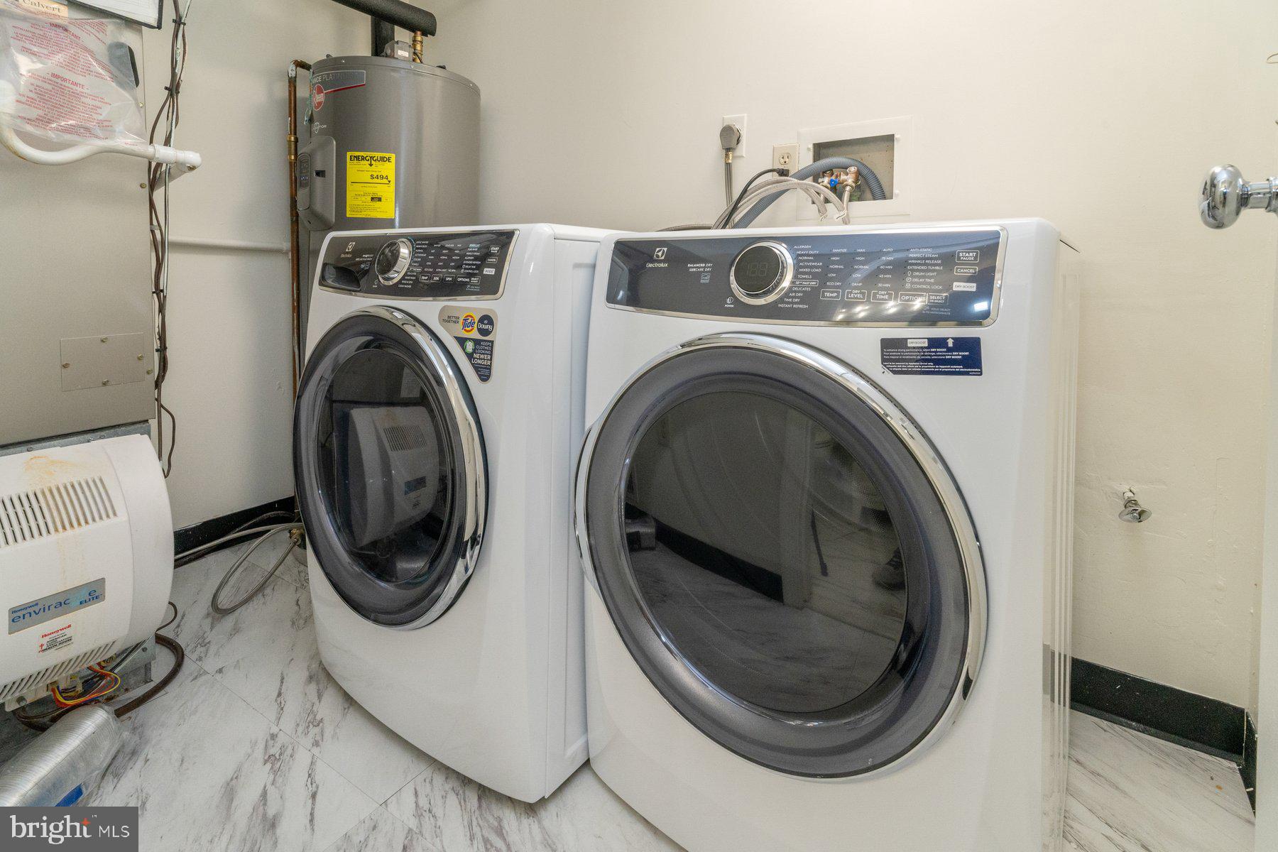 2331 Old Court Road, Unit 201 Baltimore, MD 21208 - Photo 20 of 38 a utility room with dryer and washer