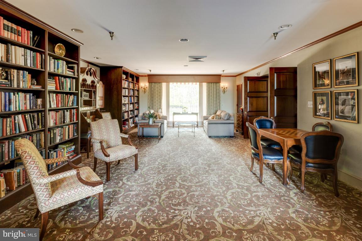 2331 Old Court Road, Unit 201 Baltimore, MD 21208 - Photo 25 of 38 a living room with furniture and a book shelf