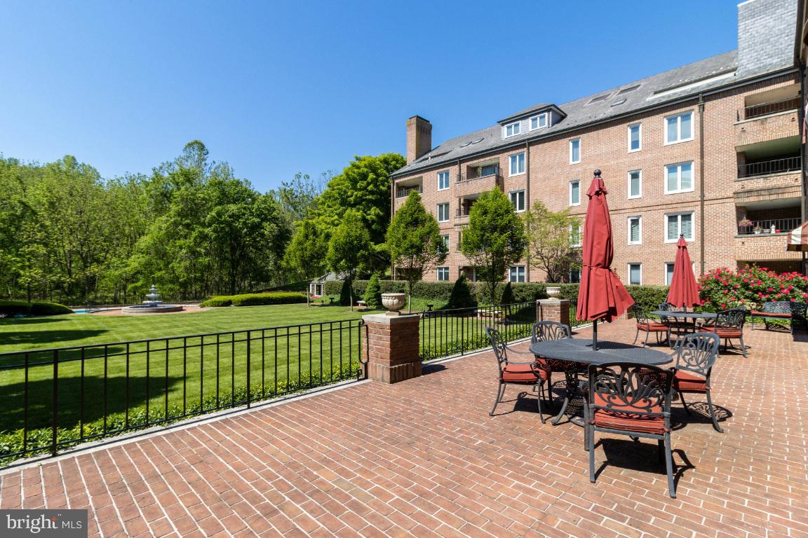 2331 Old Court Road, Unit 201 Baltimore, MD 21208 - Photo 29 of 38 a backyard of a house with wooden floor and outdoor seating
