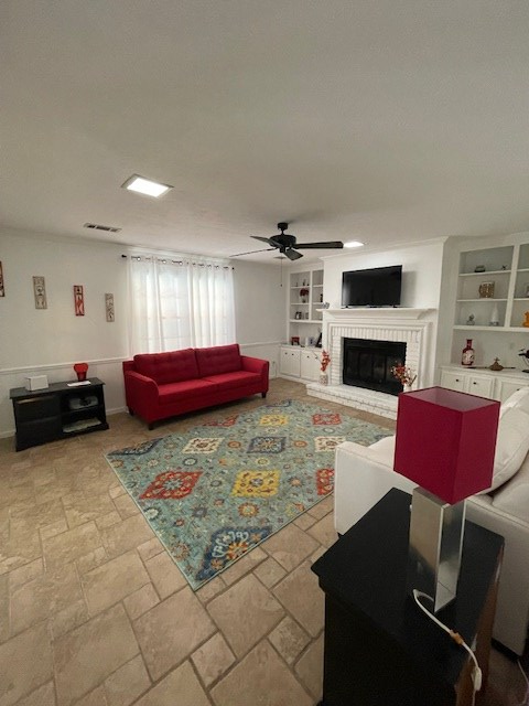 4537 Sears Road Columbus, GA 31907 - Photo 12 of 41 a living room with furniture a flat screen tv and a fireplace