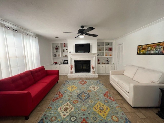4537 Sears Road Columbus, GA 31907 - Photo 14 of 41 a living room with furniture a flat screen tv and a fireplace