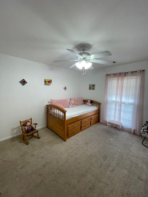 4537 Sears Road Columbus, GA 31907 - Photo 29 of 41 a spacious bedroom with a bed and a chandelier