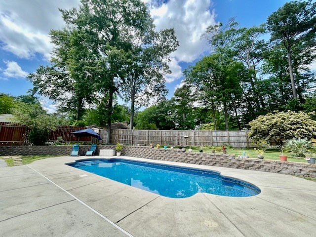 4537 Sears Road Columbus, GA 31907 - Photo 34 of 41 a swimming pool with outdoor seating and yard