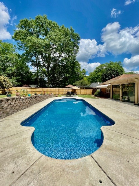 4537 Sears Road Columbus, GA 31907 - Photo 35 of 41 a view of a swimming pool with an outdoor space