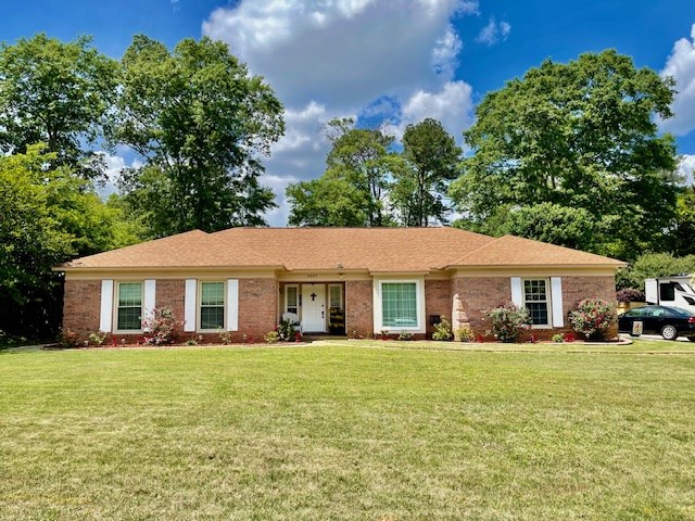 4537 Sears Road Columbus, GA 31907 - Photo 41 of 41 a front view of a house with a garden and trees
