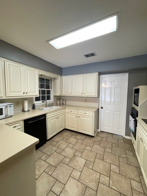 4537 Sears Road Columbus, GA 31907 - Photo 6 of 41 a large kitchen with a stove a sink dishwasher and a refrigerator