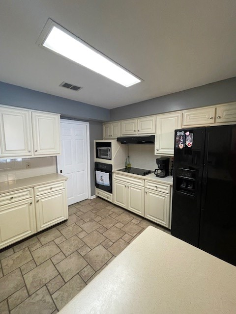 4537 Sears Road Columbus, GA 31907 - Photo 9 of 41 a kitchen with granite countertop a refrigerator stove and sink